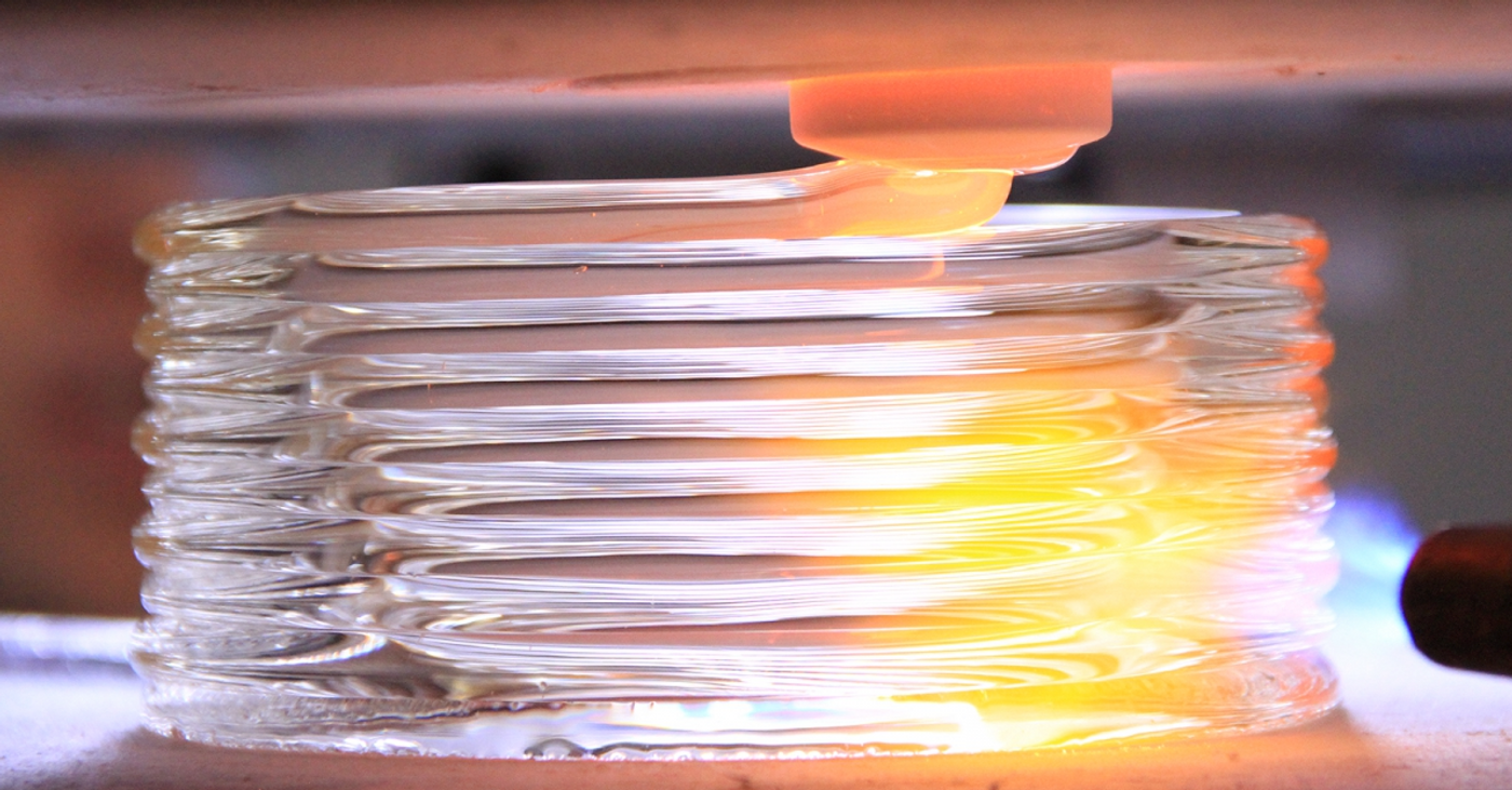 The 3D printer creates a molten glass work of art.
