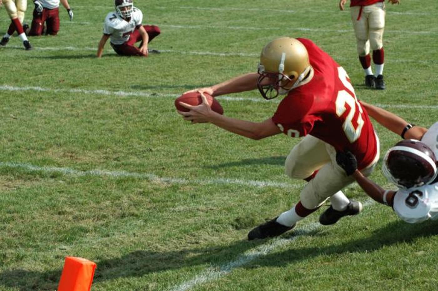 Football players who suffer concussions early in life can pay a steep price later.