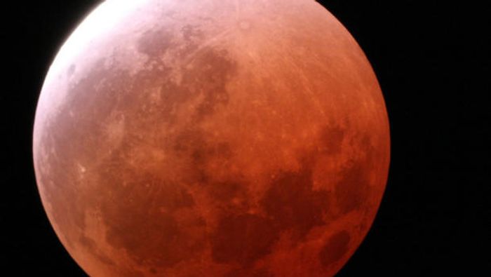 A Lunar Eclipse gives the moon a red tint.