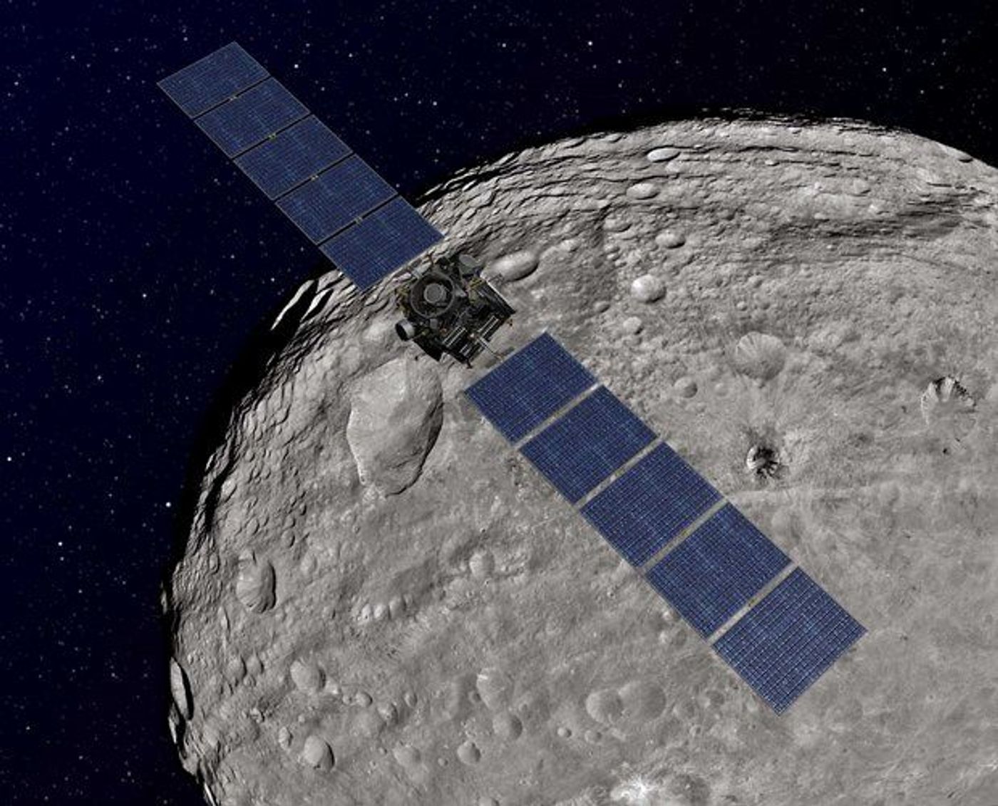 NASA's artist image shows the Dawn probe orbiting the asteroid Vesta en route to Ceres orbit