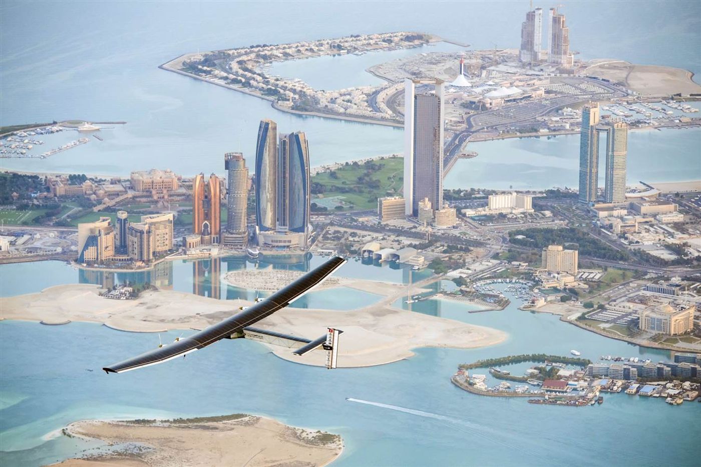 The Solar Impulse 2 flies over Abu Dhabi on a test flight on Feb. 26. The solar-powered plane has a wingspan of 236 feet, larger than that of a Boeing 747, but weighs only 4600 pounds, about as much as a family car. More than 17,000 solar cells on the wing power lithium-ion batteries in four electric motors. The airframe makes use of carbon fiber, which is three times lighter than paper, to keep the plane as light as possible.
