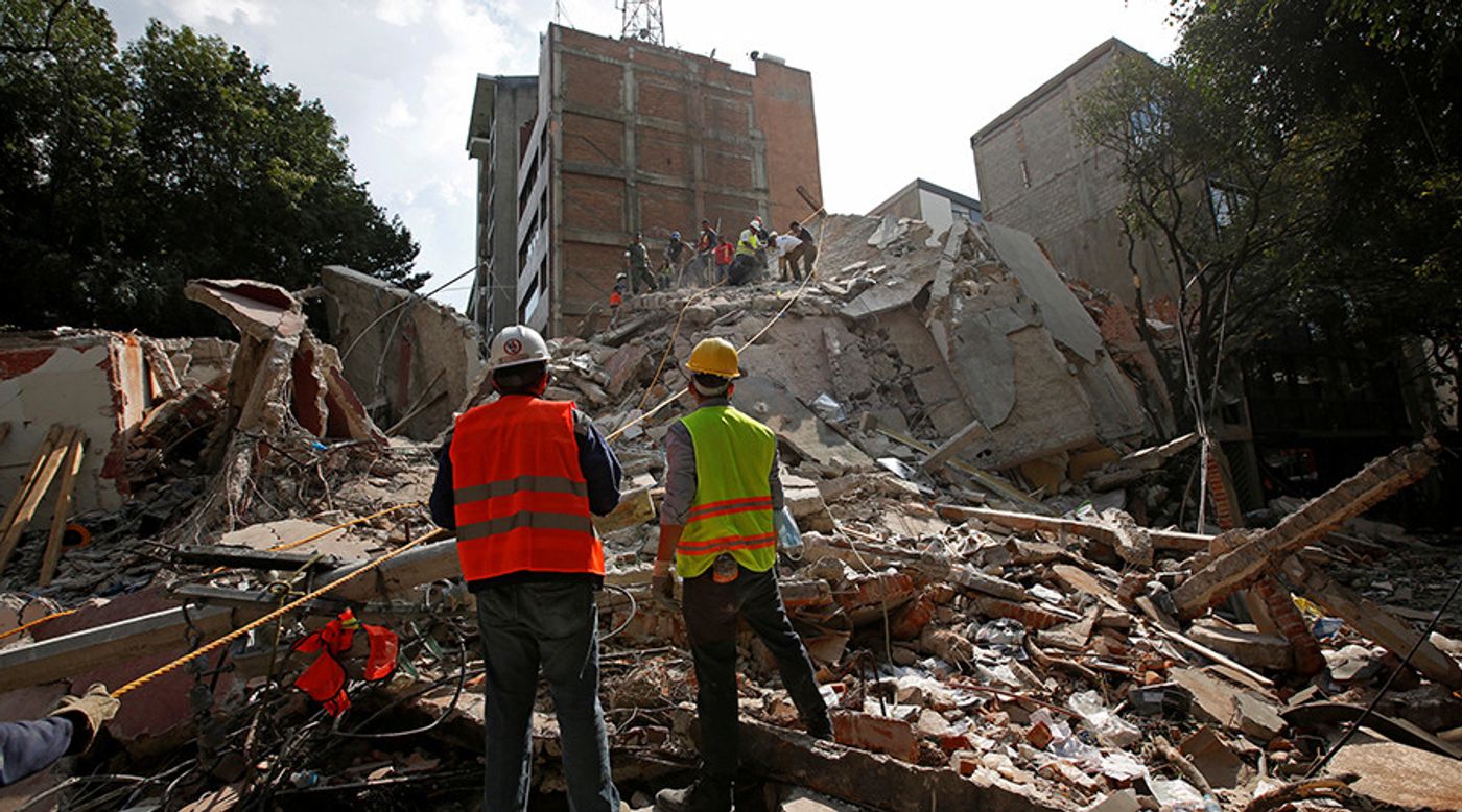 Emergency workers conduct search and rescue missions. Photo: RT