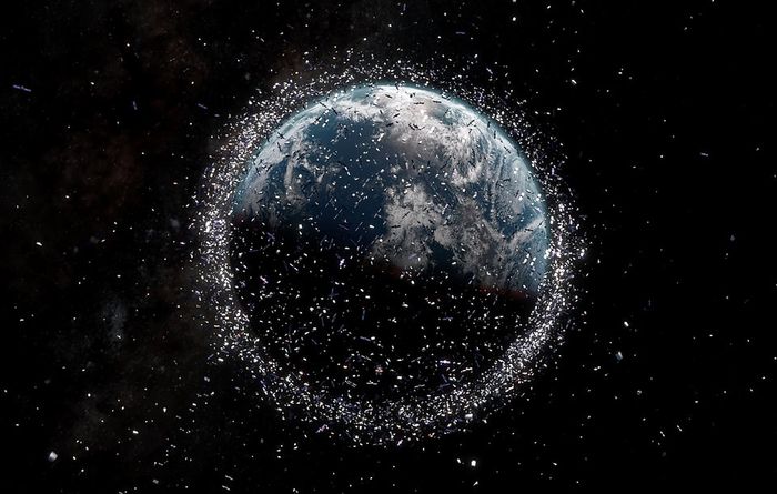 An artist's illustration of the space junk orbiting the Earth today (not to scale).
