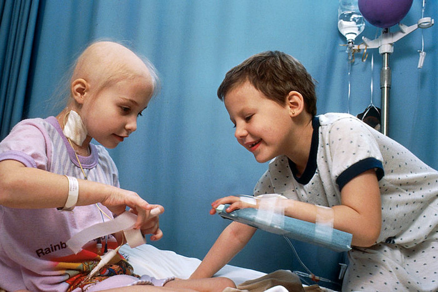 Two young girls with acute lymphocytic leukemia (ALL) receiving chemotherapy. Credit: National Cancer Institute