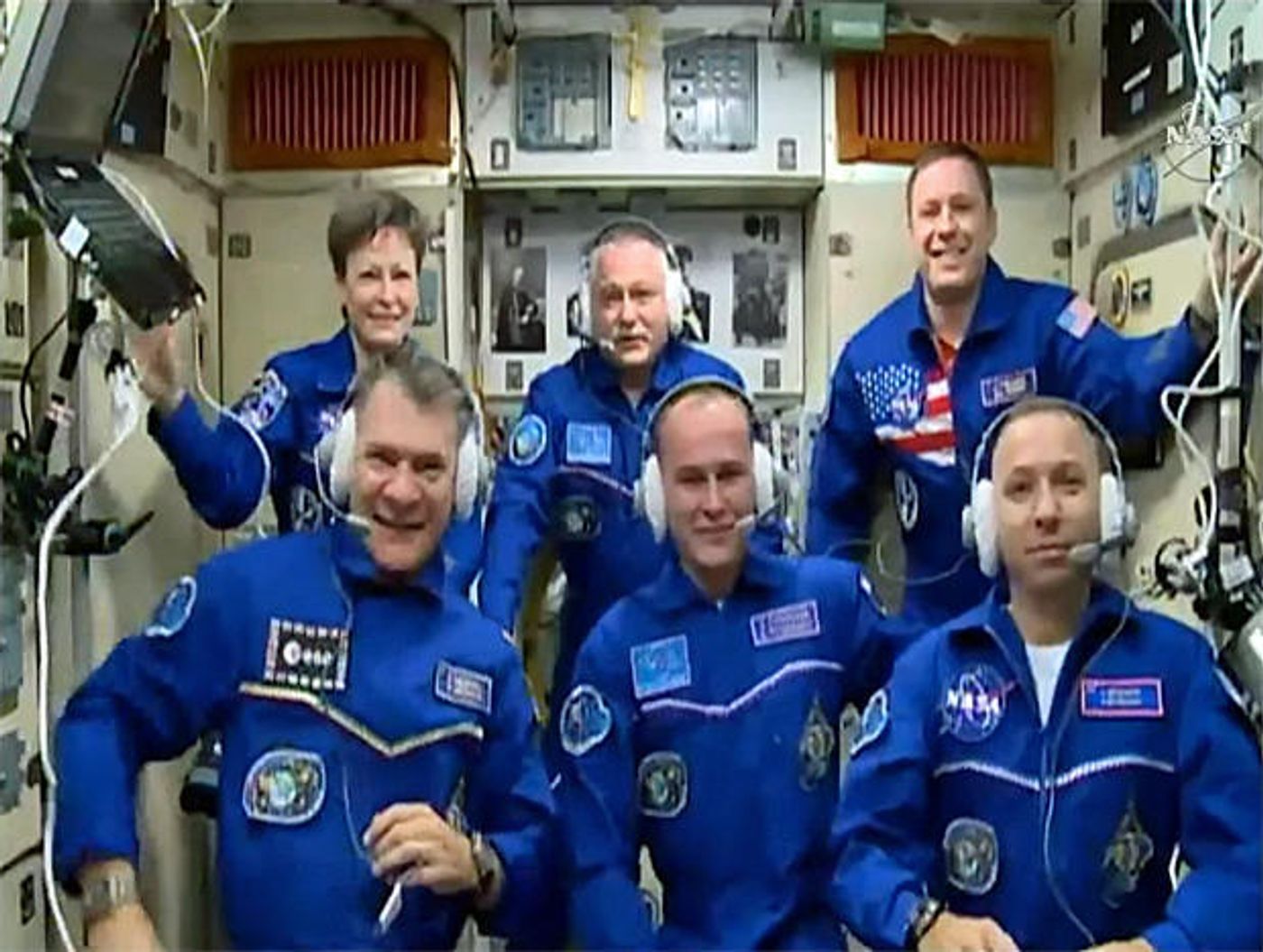 A group photo of the new and old astronauts/cosmonauts after the Soyuz spacecraft safely delivered three more men on Friday.