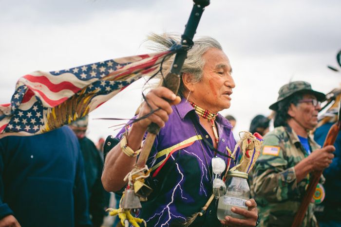 Phil Little Thunder Sr., from the Rosebud reservation in South Dakota, carries water from his hometown for the sacred ceremony to the burial ground in North Dakota. Photo: Alyssa Schukar for The New York Times