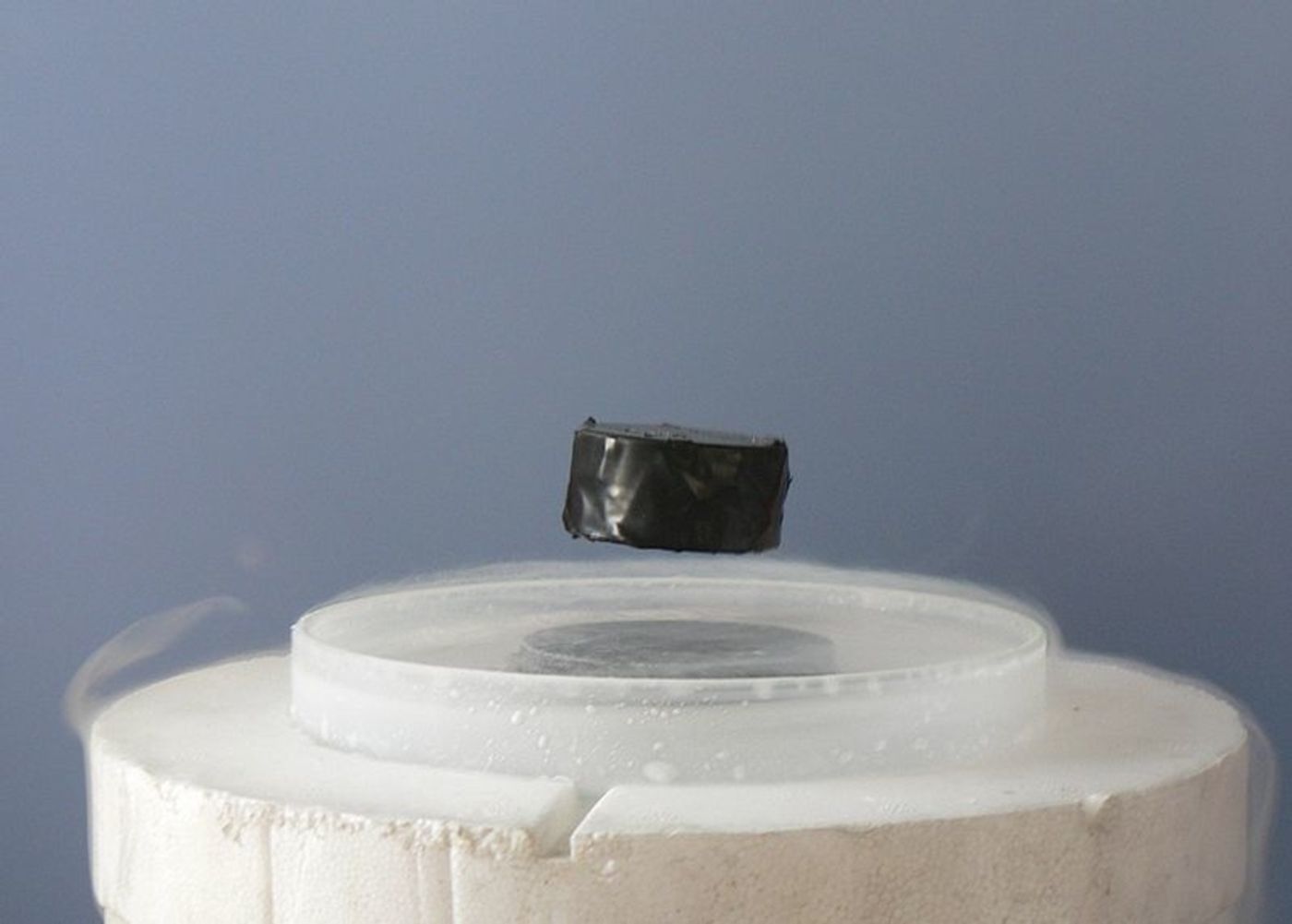 A chilled superconductor levitated over a magnet (Wikimedia Common)
