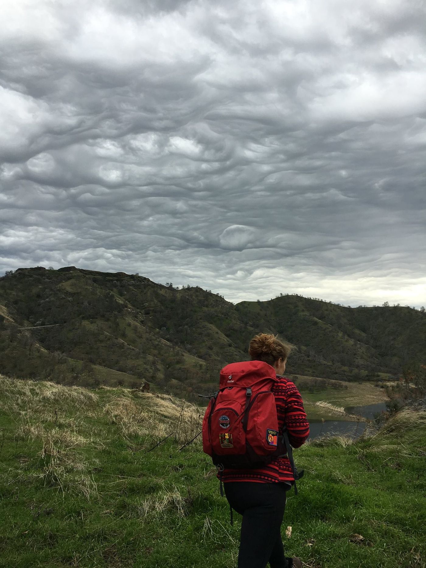 Hiking under storm clouds at Millerton Lake near Fresno, California. (Credit: Abbie Sandquist)
