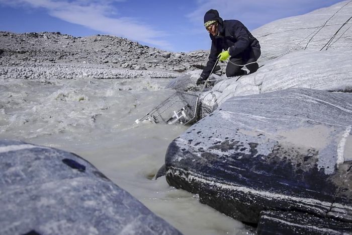 This is Guillaume Lamarche-Gagnon deploying the methane sensor that was used in the study into the proglacial river that drains the Greenland Glacier. / Credit: Marie Bulinova