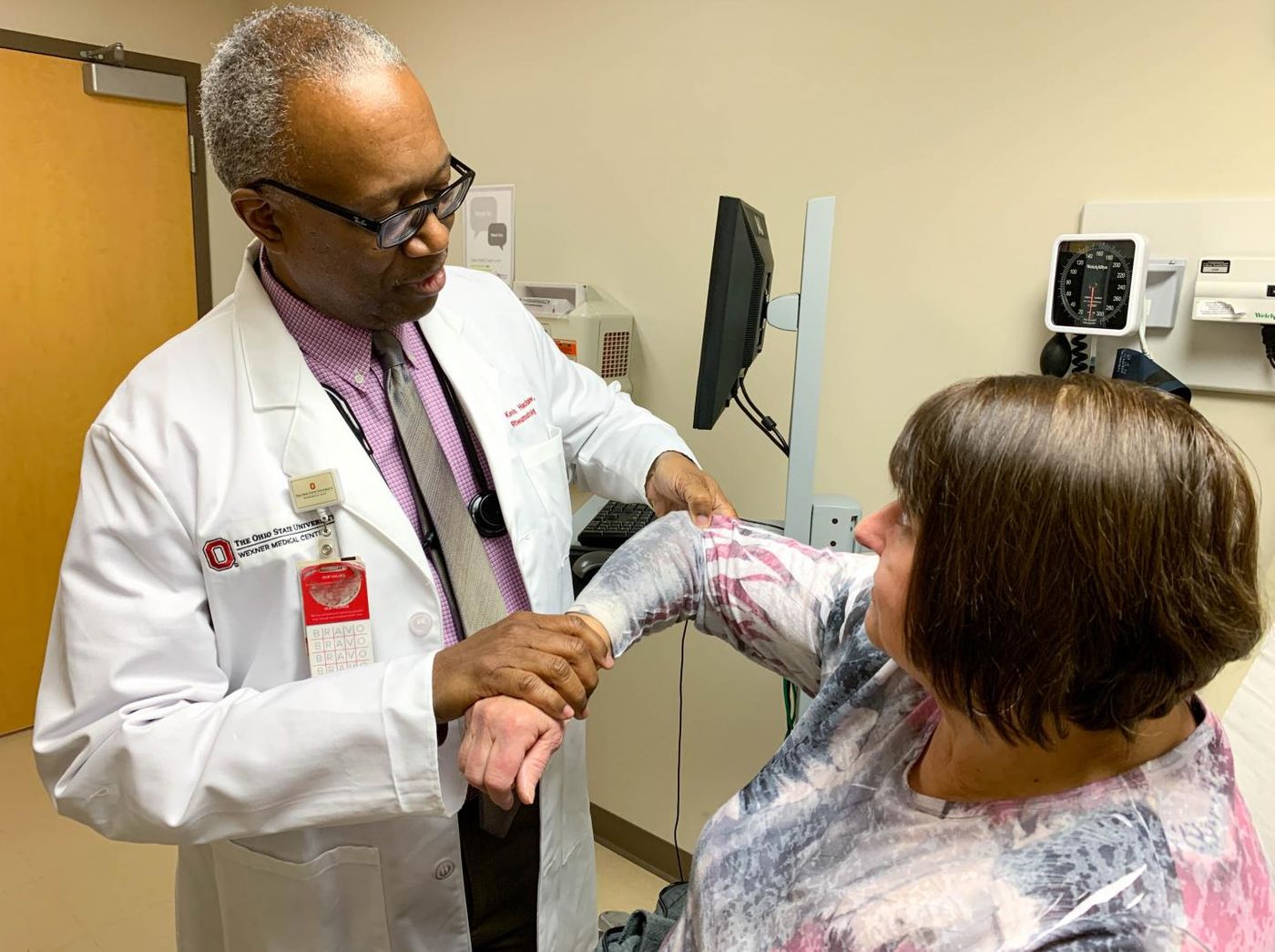 Dr. Kevin Hackshaw examines fibromyalgia patient Barb Hartong at The Ohio State University Wexner Medical Center. A new blood test may one day guide personalized treatment plans to relieve fibromyalgia pain. / Credit: The Ohio State University Wexner Medical Center