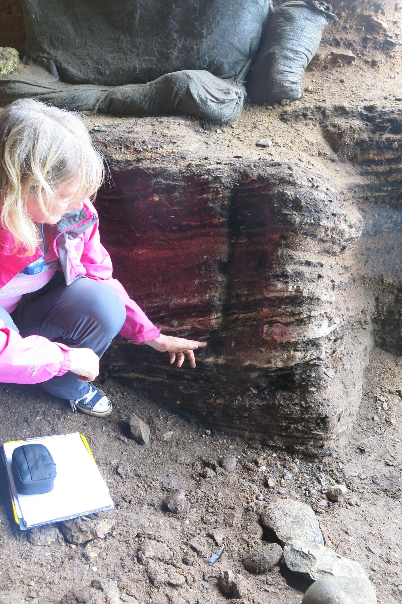 Cynthia Larbey points to an area where parenchyma were found in 65,000 year old hearths at Klasies River Cave. / Credit: Wits University