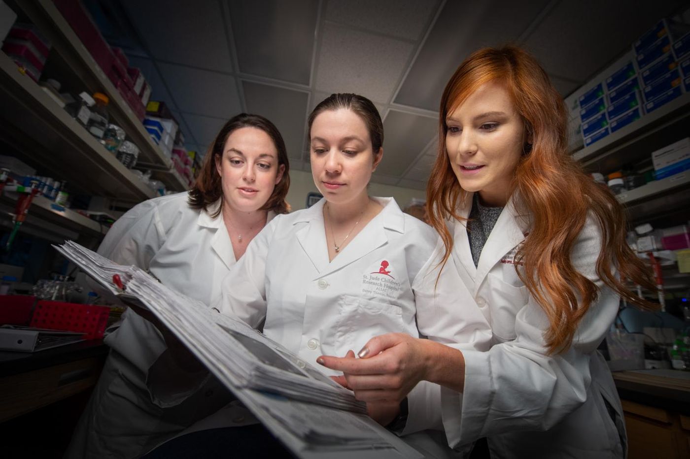 St. Jude scientists have used a 3D genome to improve understanding of gene regulation during development and disease. Pictured here, left to right, are Jackie Norrie, Ph.D.; Marybeth Lupo, Ph.D.; and Victoria Honnell, a graduate student, who work in the lab of Michael Dyer, Ph.D. / Credit: St. Jude Children's Research Hospital