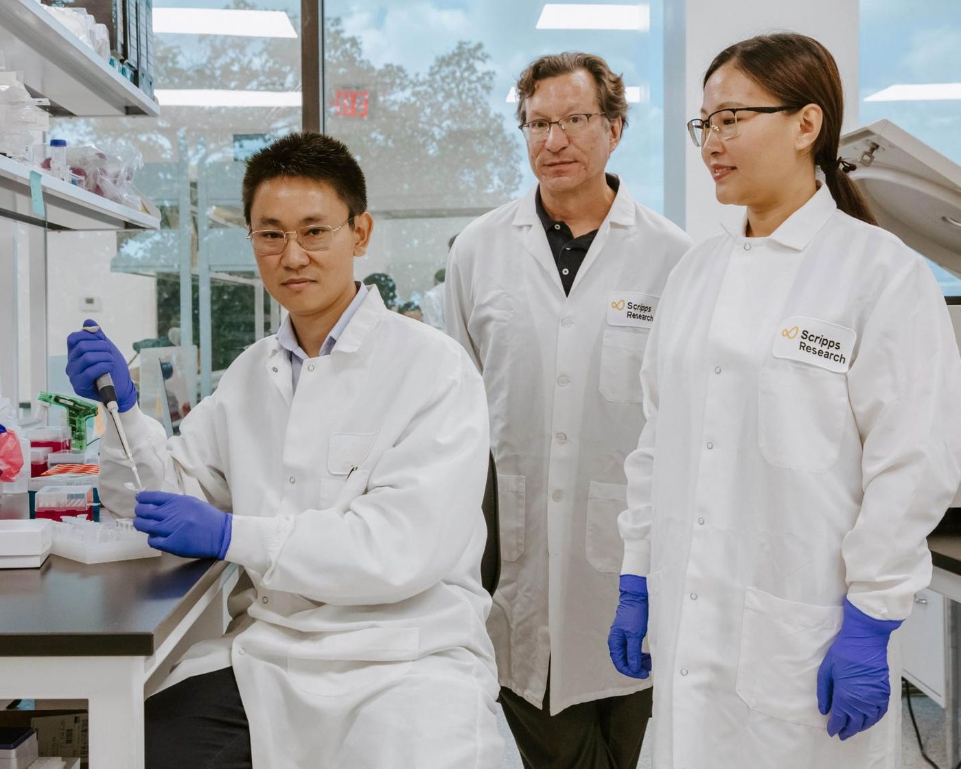 Scripps Research Immunology Professor Michael Farzan, PhD, developed a gene therapy switch with postdoctoral researcher Guocai Zhong, PhD and research assistant Haimin Wang. / Credit: Scripps Research