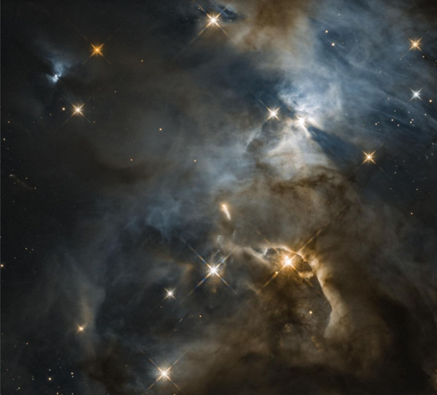 Astronomers using Hubble previously captured a remarkable image of a young star's unseen, planet-forming disk casting a huge shadow across a more distant cloud in a star-forming region. The star is called HBC 672, and the shadow feature was nicknamed the "Bat Shadow" because it resembles a pair of wings. The nickname turned out to be unexpectedly appropriate, because now those "wings" appear to be flapping! / Credit: NASA, ESA, and STScI