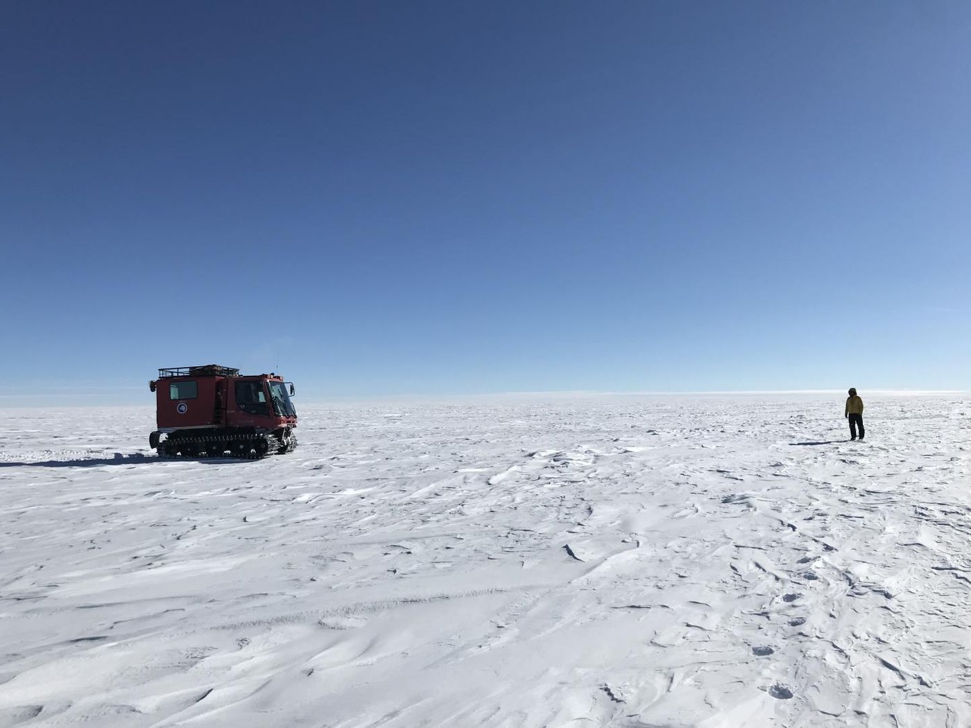 NASA scientists on the Antarctic Ice Sheet during a 470-mile expedition in 2019, meant to assess the accuracy of data gathered in space by the Ice Cloud and land Elevation Satellite-2 (ICESat-2). / Credit: NASA's Goddard Space Flight Center/Dr. Kelly Brunt