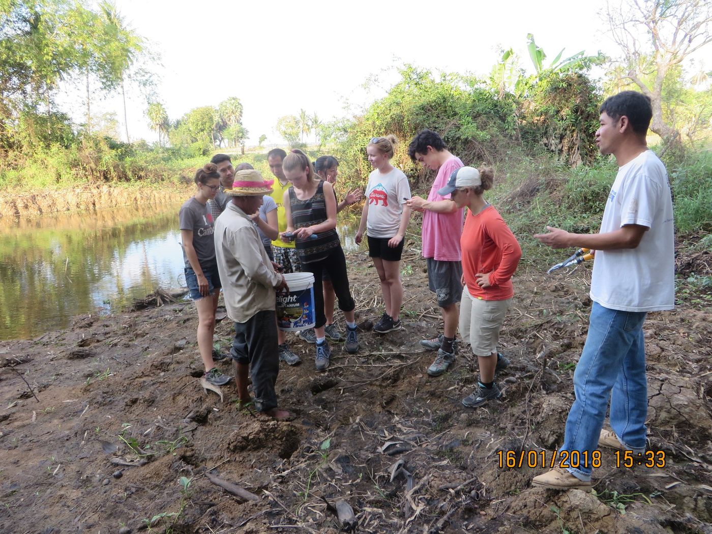 Learning about fishing ponds and sustainable irrigation plans at a local farm near Banteay Chhmar, Cambodia. (Credit: Abbie Sandquist)