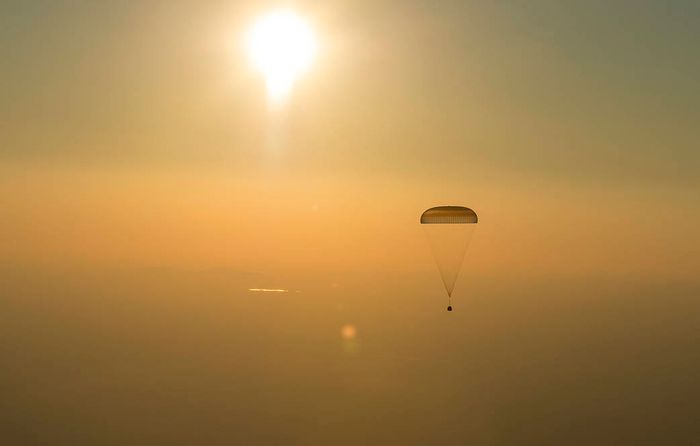The Soyuz spacecraft begins its descent back to Earth.