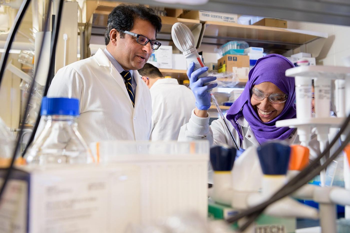 University of Delaware biologist Salil Lachke's research focuses on eye lens development. Here, he works in the lab with graduate student Salma Alsaai. / Credit: University of Delaware/ Evan Krape