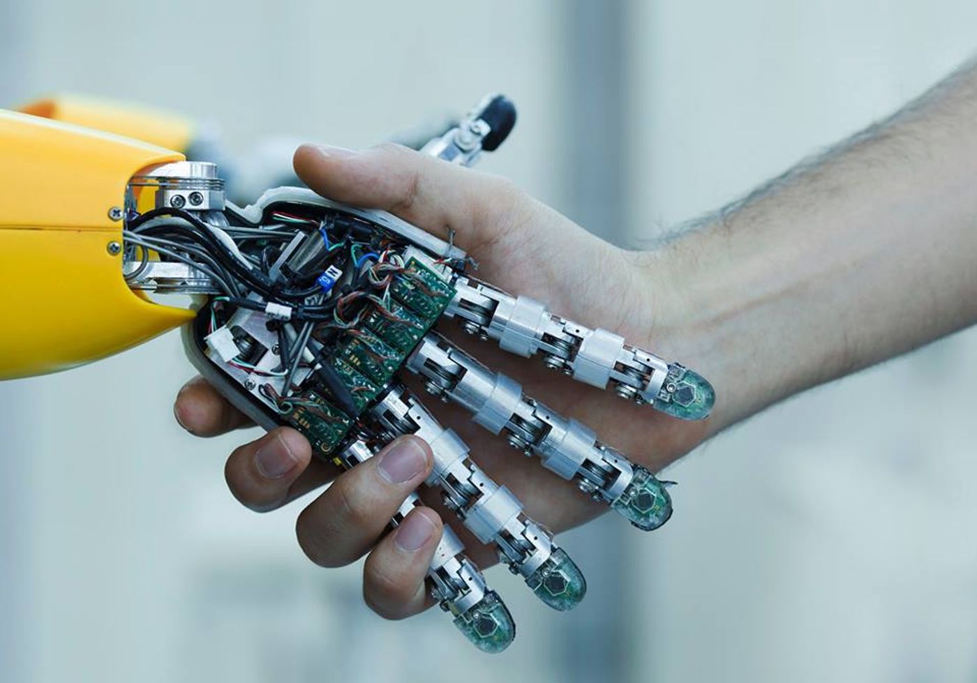 Robot and human hand, credit: Sachin Lulla public Facebook photo (facebook.com/SachinLulla.IBM/)