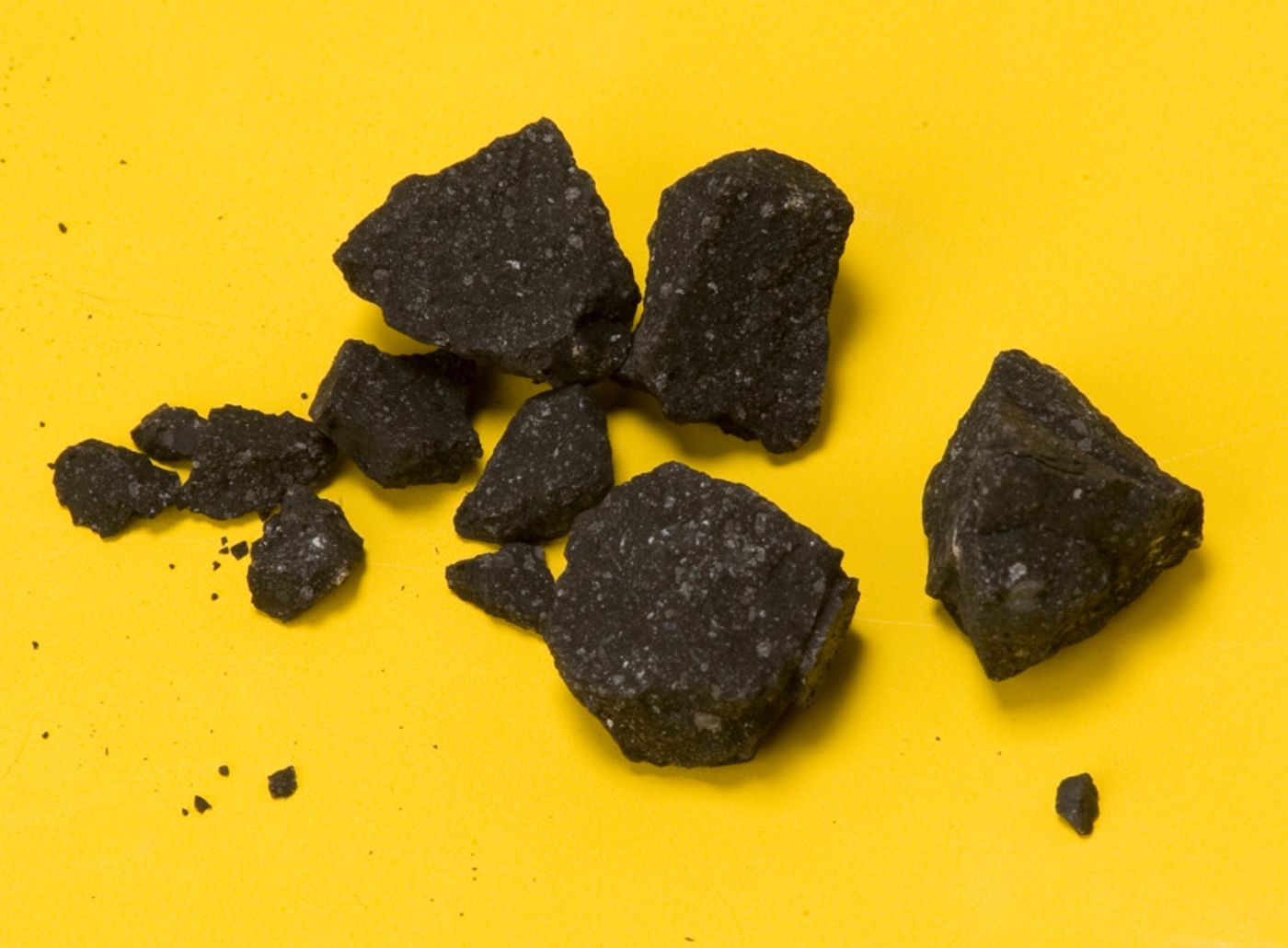 This image from NASA is of samples from Sutter's Mill Meteorite, a carbonaceous chondrite which landed on April 22, 2012. Sutter's Mill is associated with the California Gold Rush. Image Credit P. Jenniskens (SETI Institute) and Eric James (NASA Ames) 