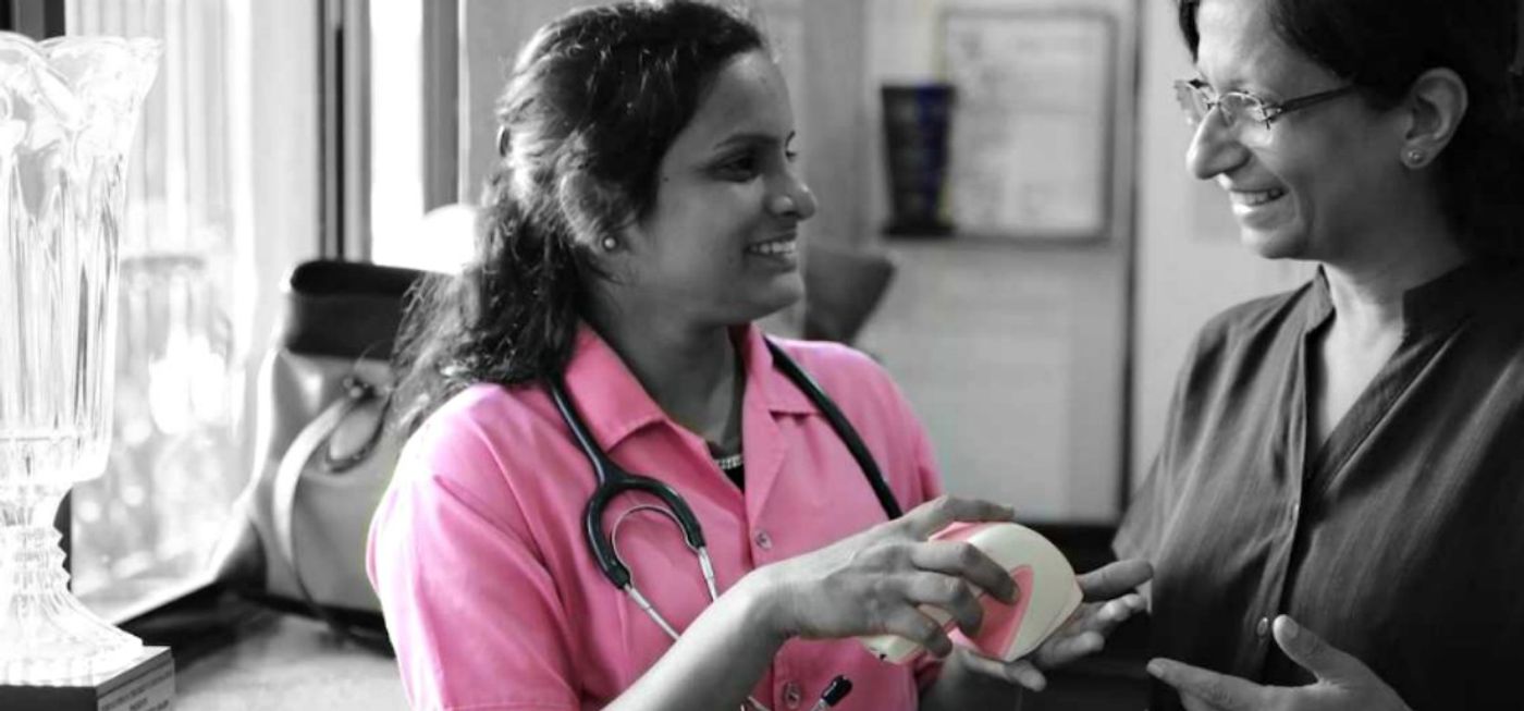 Two women with the iBreastExam, credit: UE LifeSciences