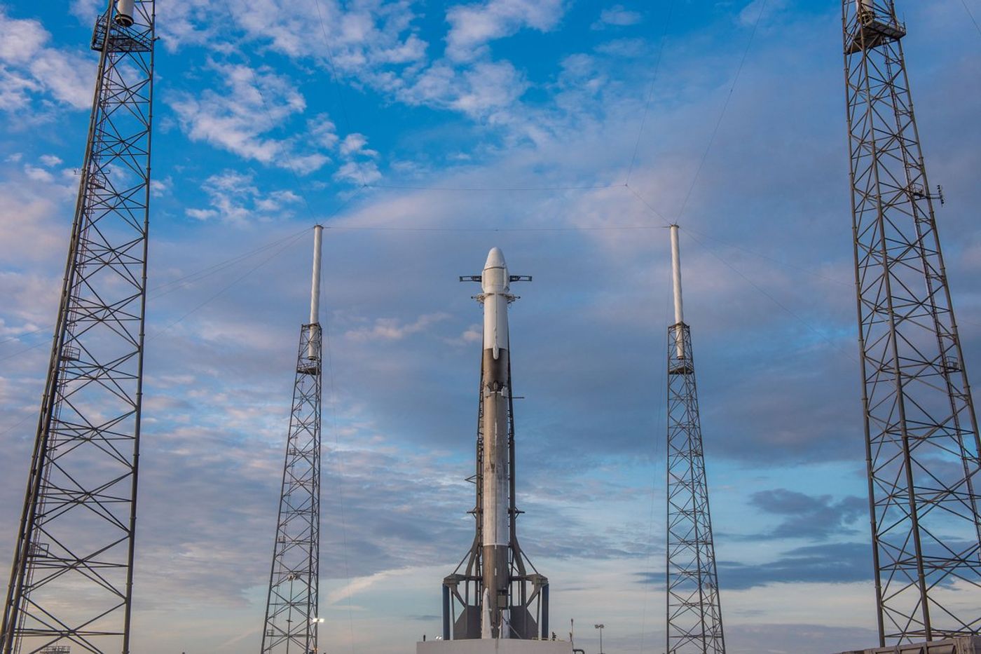 SpaceX's Falcon 9 rocket and Dragon capsule stand tall at a Cape Canaveral-based launch pad on Monday.