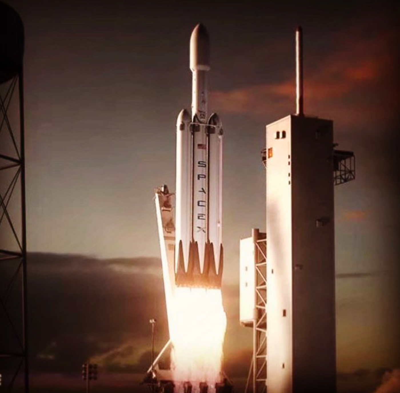 An artist's rendition of a Falcon Heavy rocket launching from its pad.