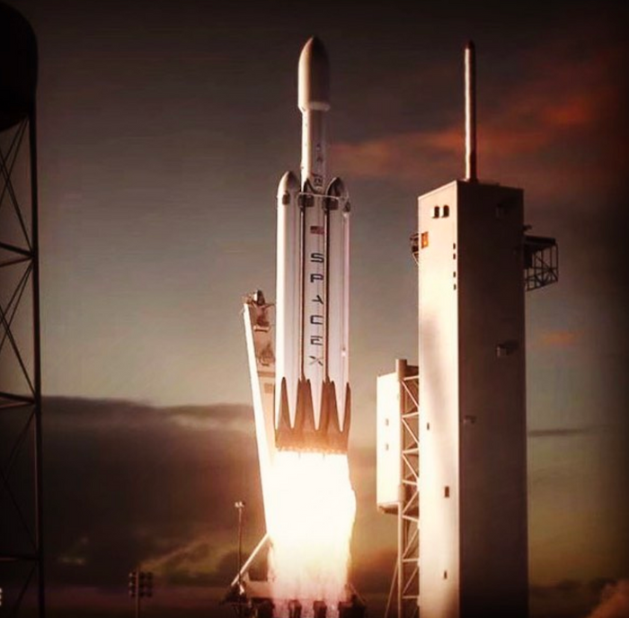 An artist's rendition of SpaceX's upcoming Falcon Heavy rocket mid-launch.