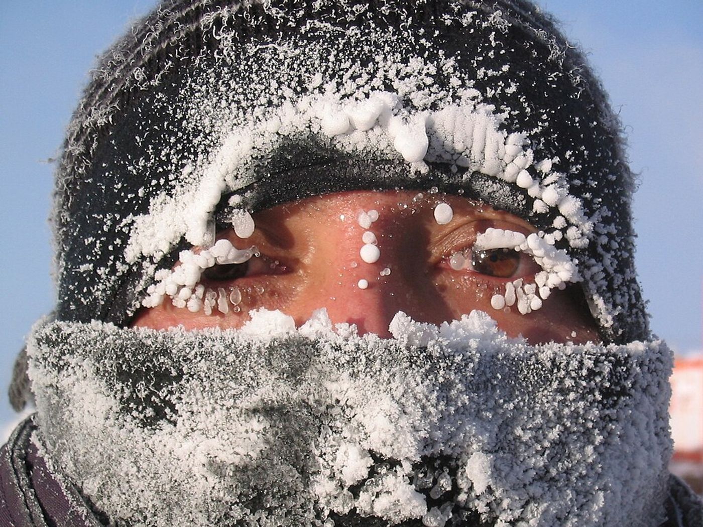 man with frost on eyelashes