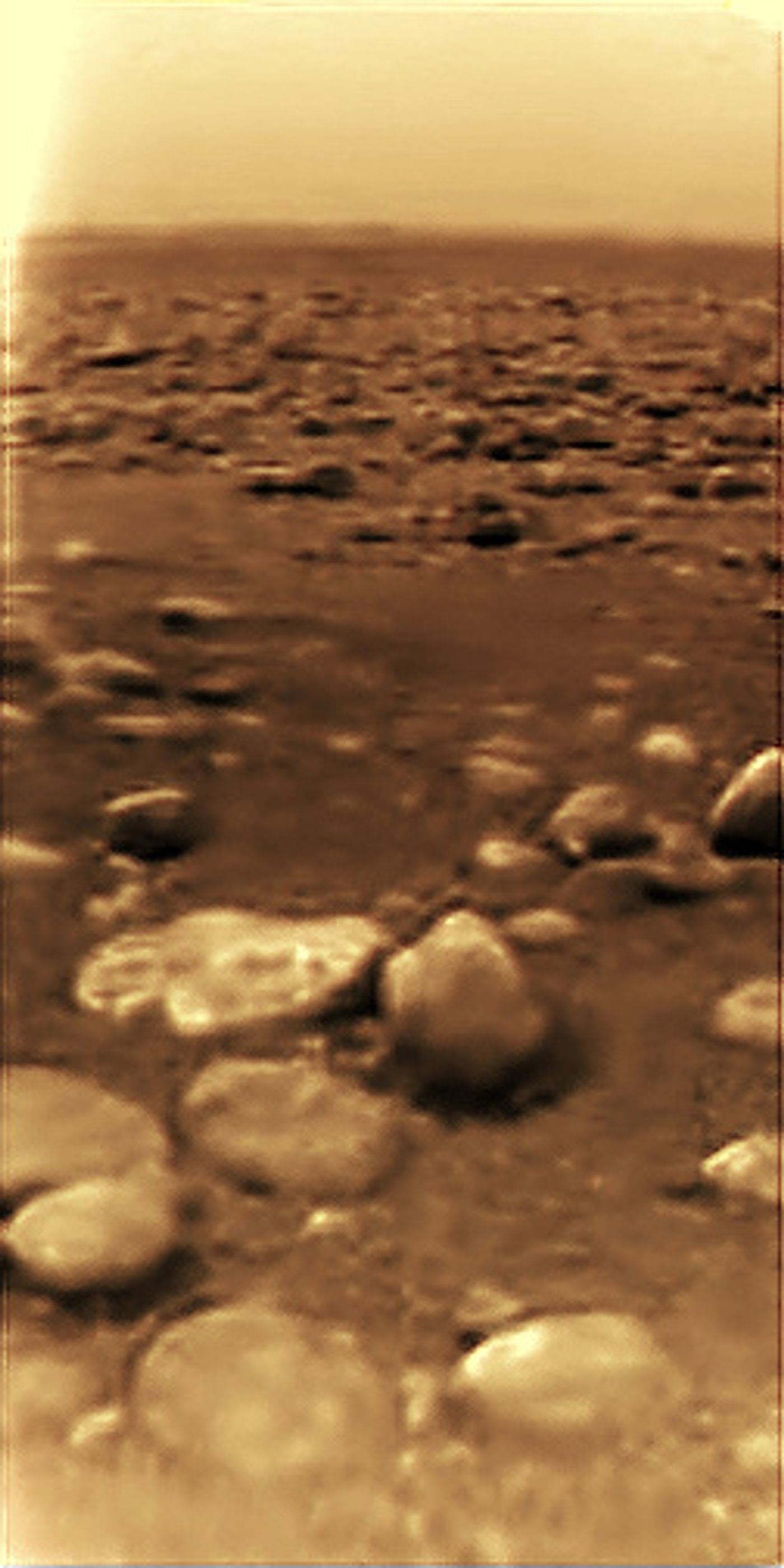 Contrast-enhanced image of Titan's surface taken by the Huygens probe. Image Credit: European Space Agency/NASA/JPL/University of Arizona; processed by Andrey Pivovarov