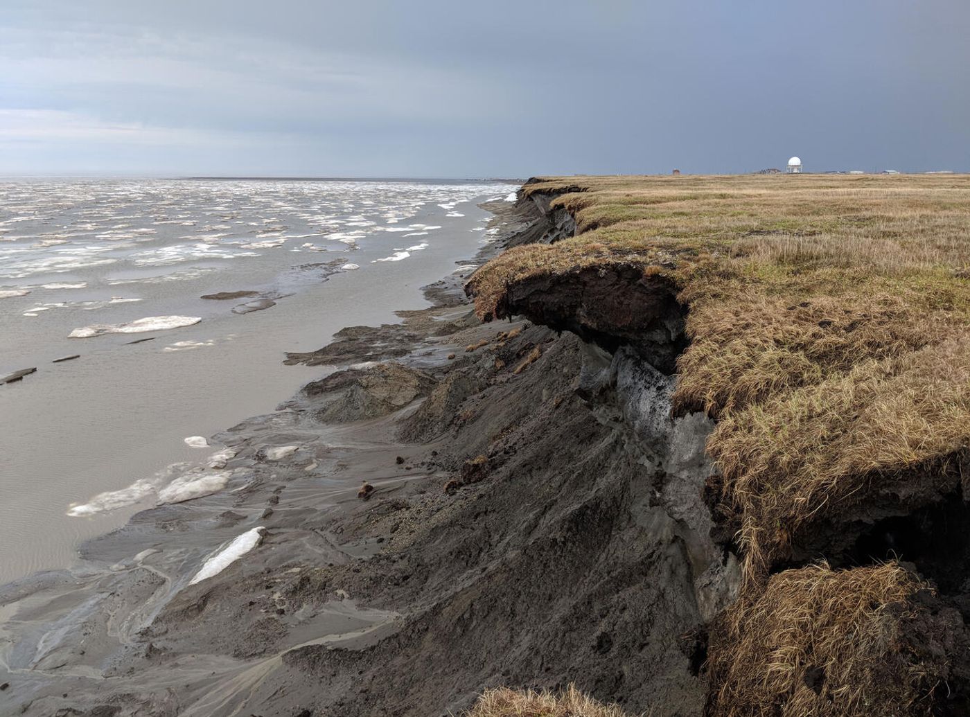 View facing east of an actively eroding coastal permafrost bluff on Barter Island, on the northern coast of Alaska. / Photo Credit: Shawn Harrison, Oceanographer, USGS Pacific Coastal and Marine Science Center