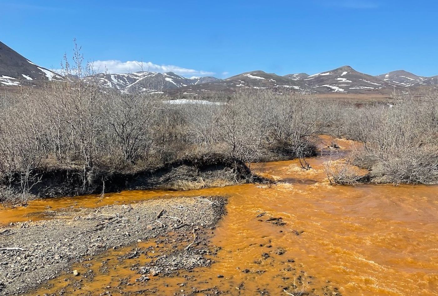 Orange water from a tributary of the Kugororuk River / Photo credit: Josh Koch, U.S. Geological Survey
