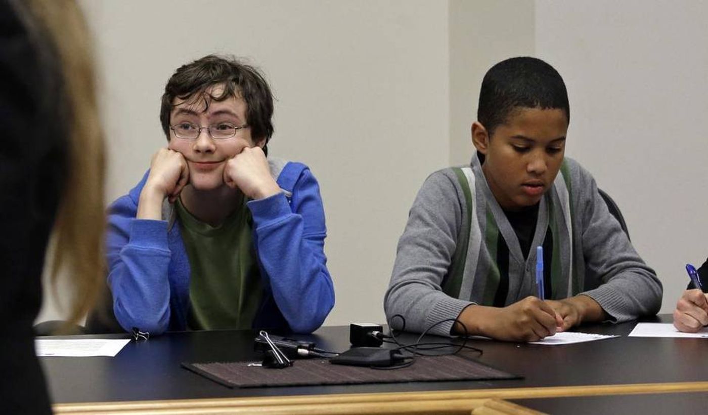 Petitioners Gabe Mandell, 14, left, and Adonis Williams, 12, look on as an attorney speaks at a court hearing Tuesday, Nov. 22, 2016, in Seattle. Elaine Thompson AP  