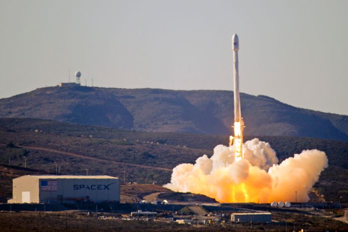 The original Falcon 9 rocket blasts off from the ground in 2013.