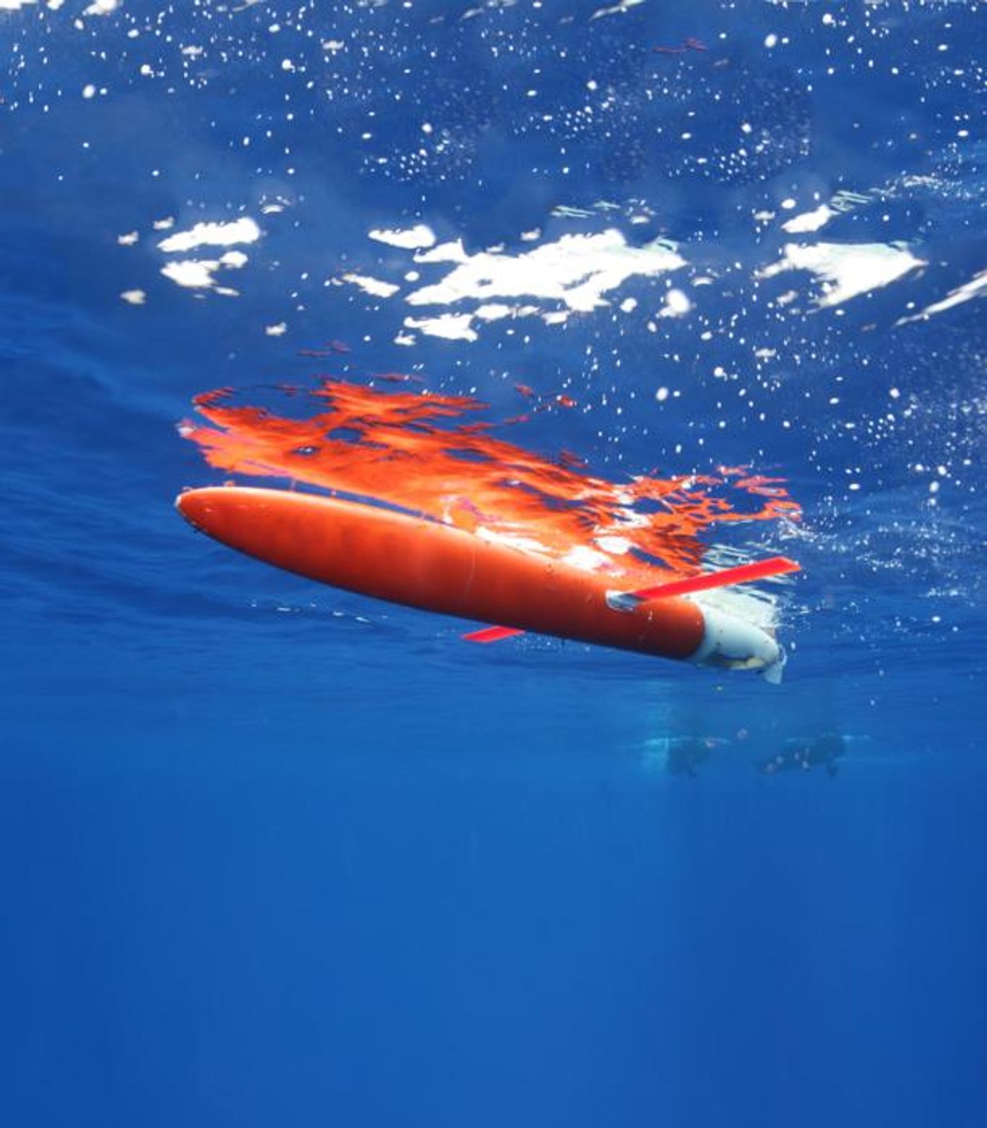 WHOI oceanographers launch Spray gliders, which provide measurements below the surface of the Gulf Stream, and complement satellites that routinely measure water temperature at the ocean surface.  Credit  Photo by Robert Todd/© Woods Hole Oceanographic Institution