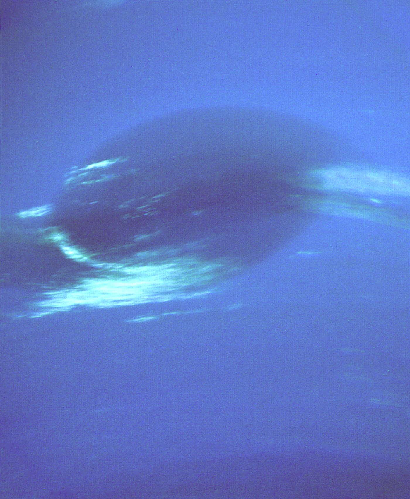 The Great Dark Spot of Neptune imaged by Voyager 2. (Image Credit: NASA JPL)
