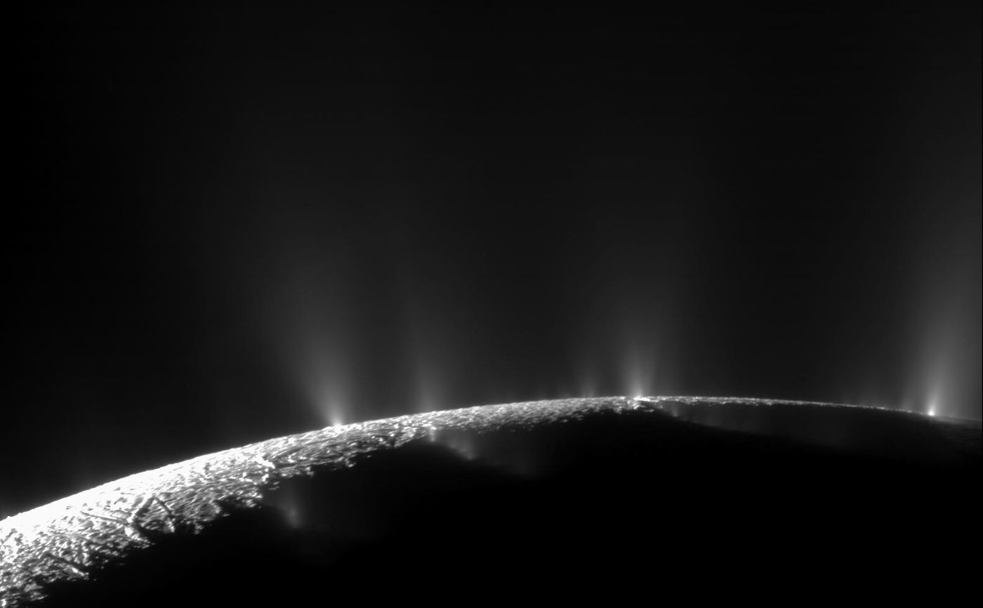 The plumes of Enceladus, captured spewing from the moon's surface by the Cassini spacecraft at a distance of 14,000 kilometers (9,000 miles) in 2010. (Credit: NASA/JPL/Space Science Institute/CICLOPS)