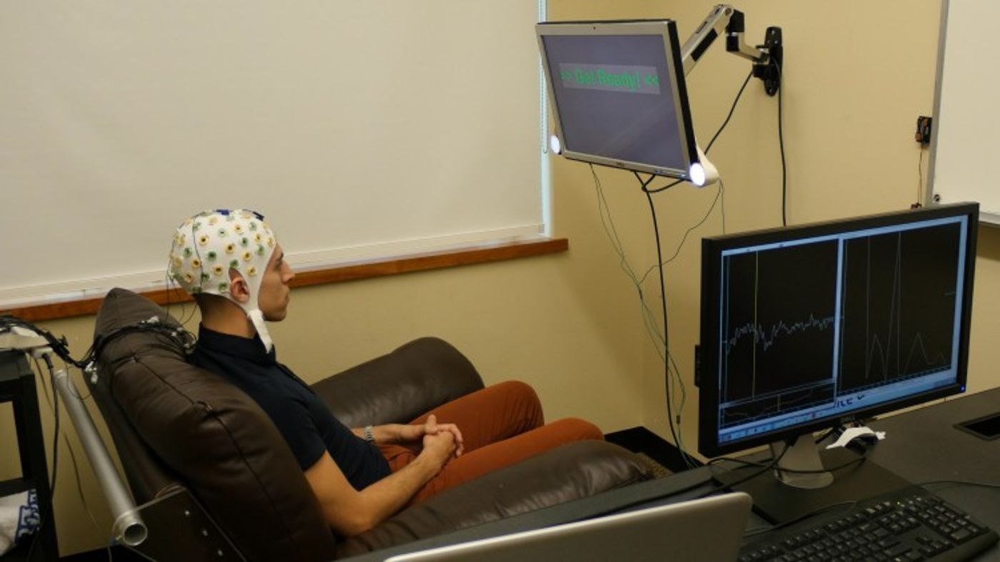 A test subject is wired up for a brain experiment