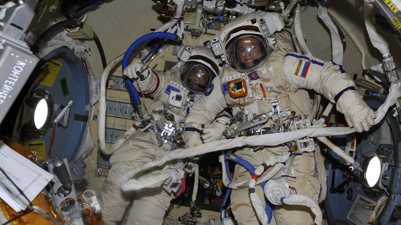 Russian Cosmonauts Fyodor Yurchikhin and Sergey Ryazanskiy pose for a picture just before their spacewalk on Thursday.