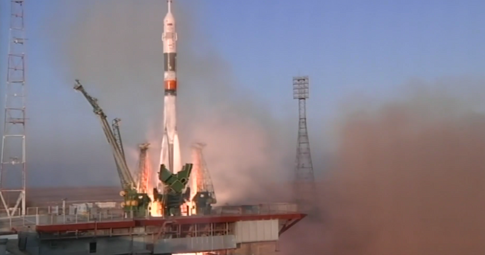 The rocket carrying Expedition 46 blasts off from the Earth.
