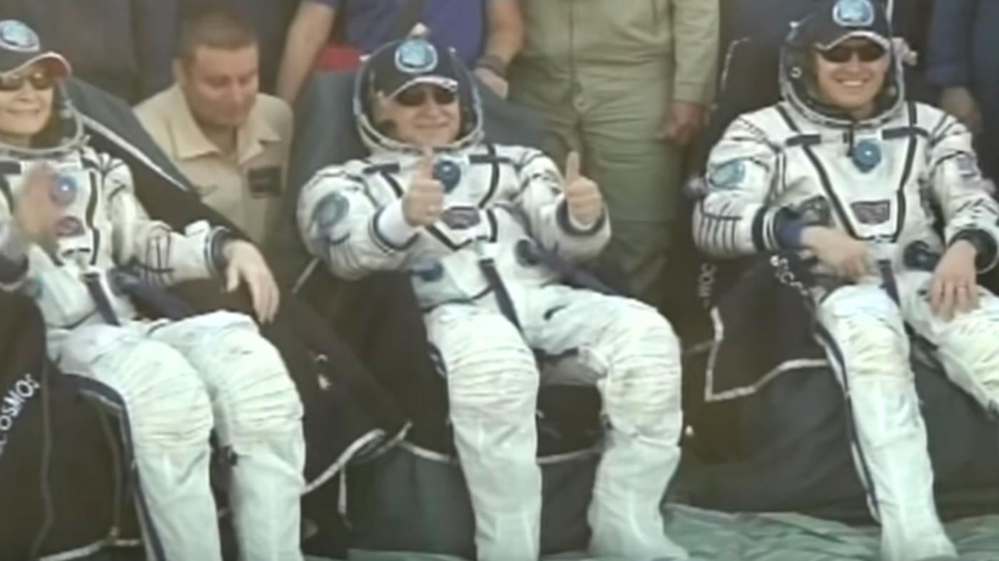 Peggy Whitson, Jack Fischer, and Fyodor Yurchikhin pose for a picture after landing in Kazakhstan.