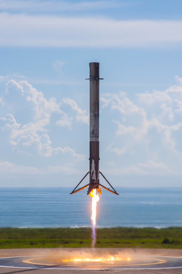 An image of the Falcon 9 rocket's first stage as it returned to Earth for an upright landing on Thursday.