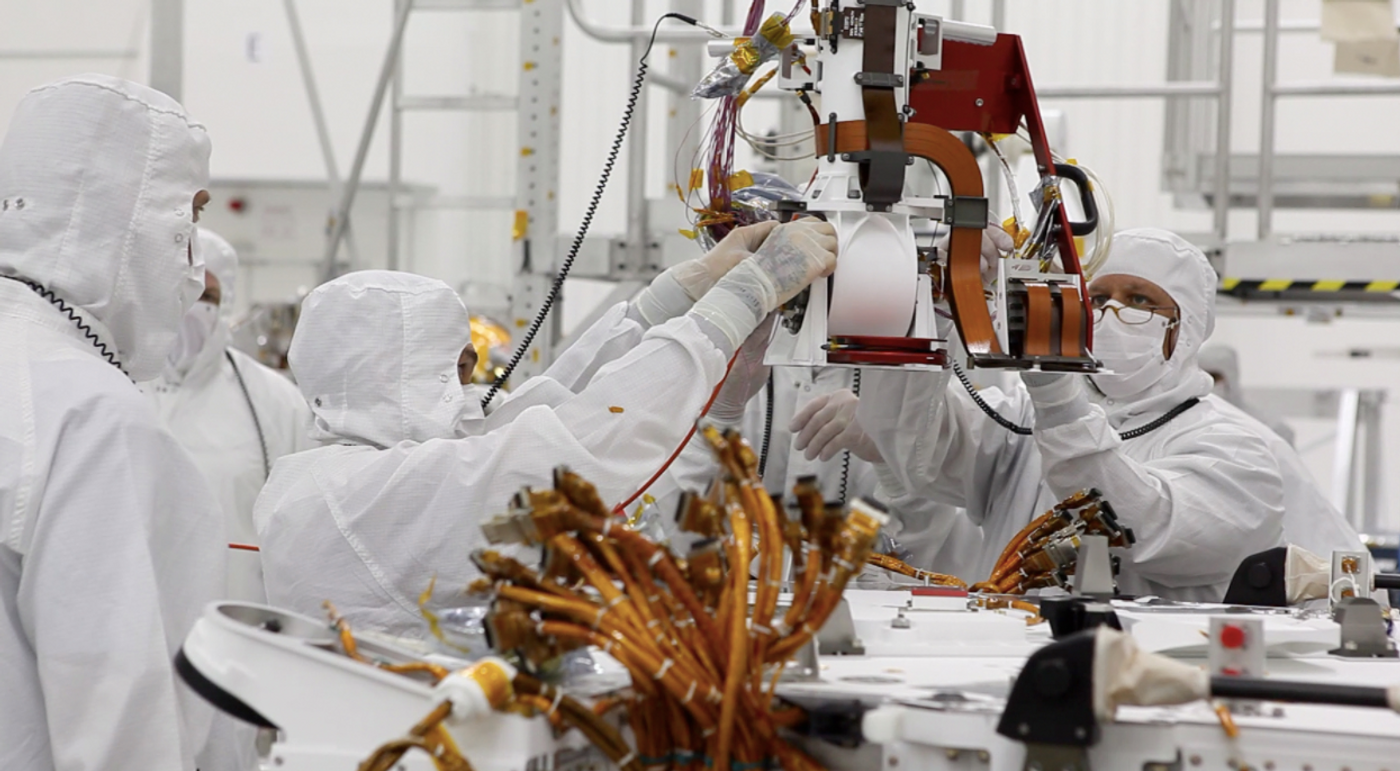 Curiosity's "eyes" (the Mastcam) are shrouded in a silvery material, awaiting their first look around the clean room at NASA's Jet Propulsion Laboratory, where the rover is being built. / Image Credit: NASA/JPL-Caltech