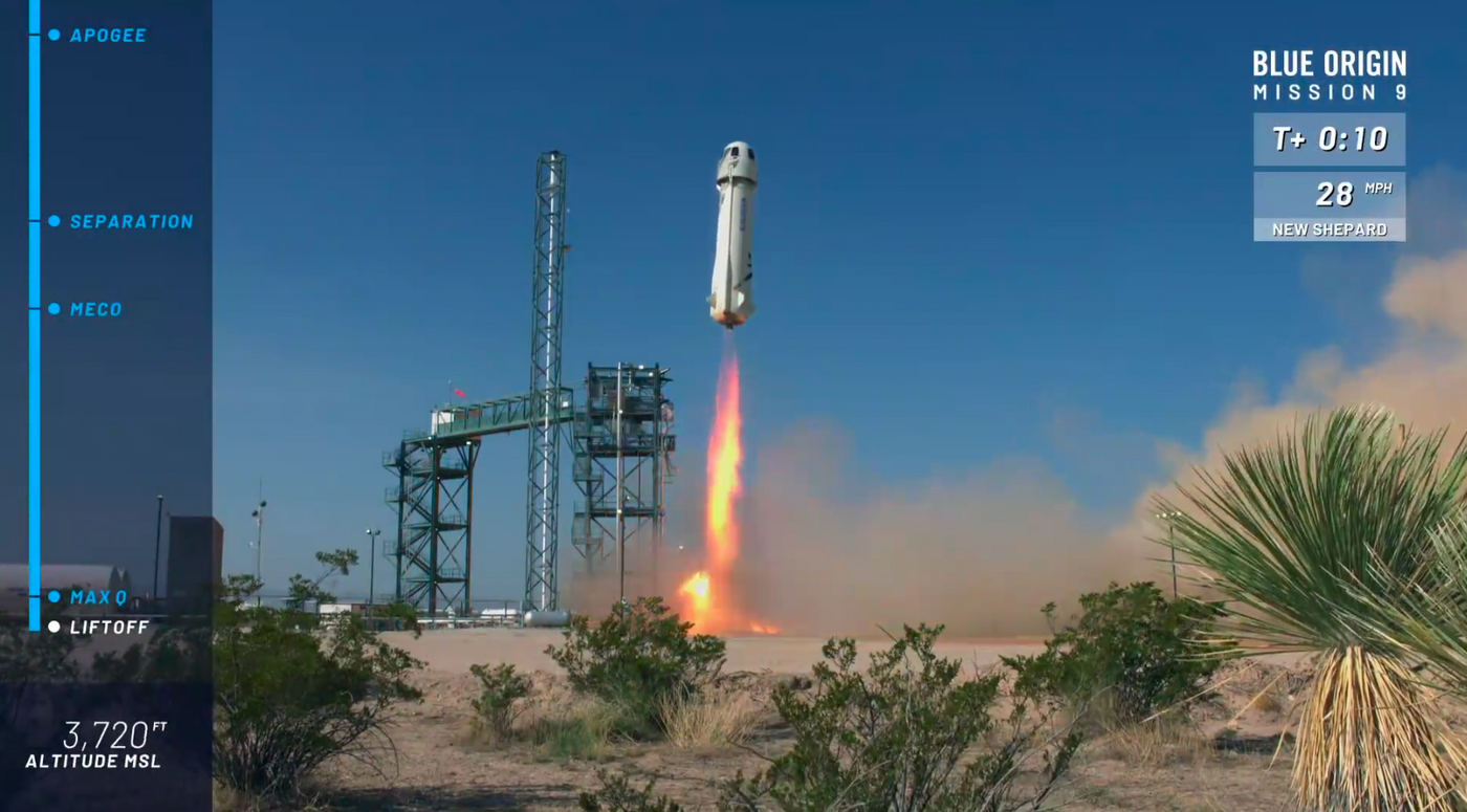 Blue Origin's New Shepard rocket blasts off from the launch pad on Wednesday.