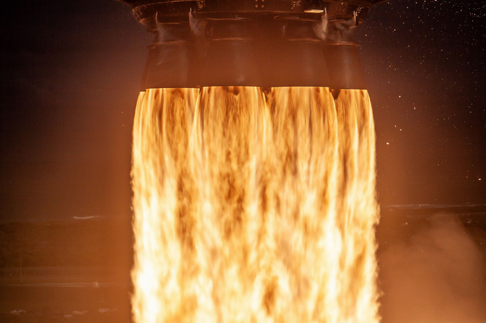 This photo depicts the exuberant flames emitted from a rocket during launch.