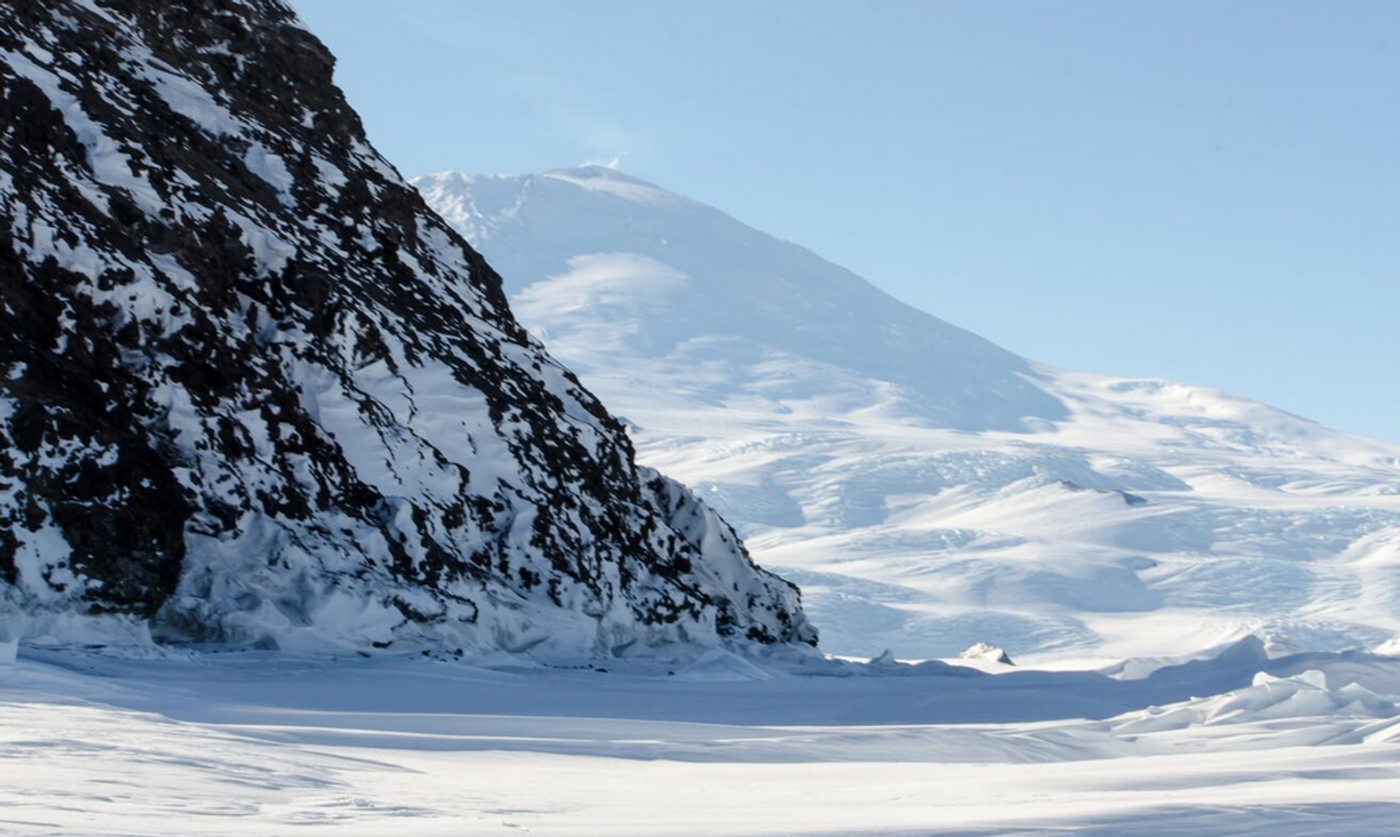   Mount Erebus in background of Inaccessible Island. Images were obtained under NMFS Permit No: 1032-1917. / Image credit:.USGS/ William Link, Ph.D.