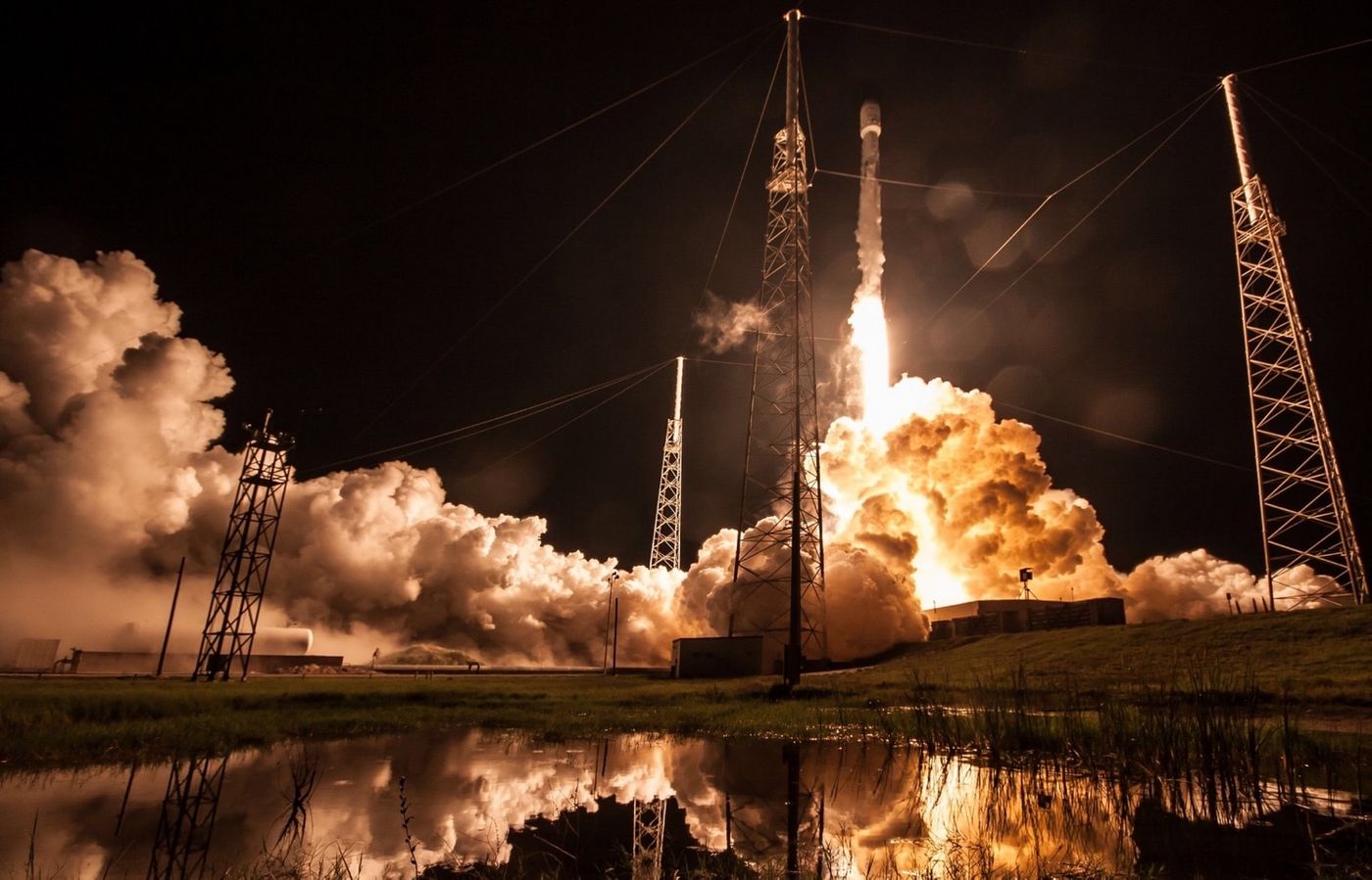 A beautiful night-time photograph showing the rocket during liftoff.