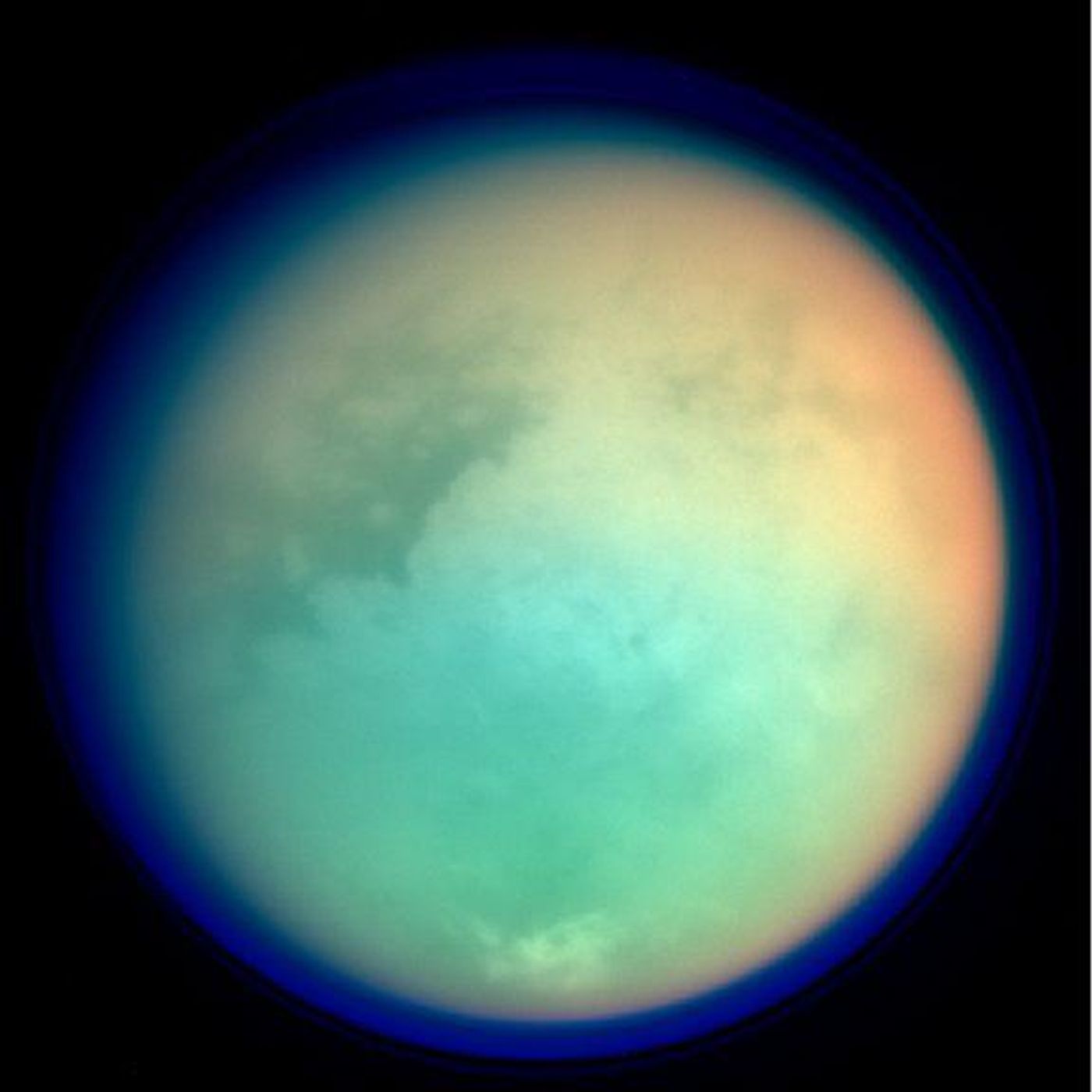 Titan in false color showing surface details and atmosphere. Image Credit: NASA/JPL/Space Science Institute