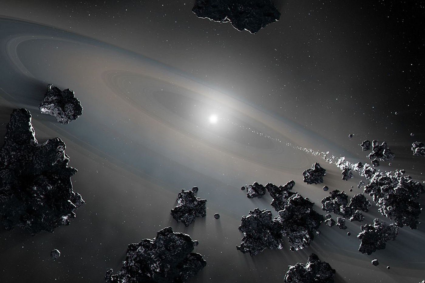 An artist's representation of a white dwarf consuming debris from shattered objects in a planetary system. Credit: NASA, ESA, Joseph Olmsted (STScI)