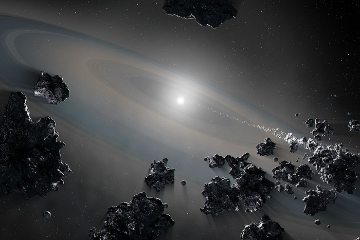 An artist's representation of a white dwarf consuming debris from shattered objects in a planetary system. Credit: NASA, ESA, Joseph Olmsted (STScI)